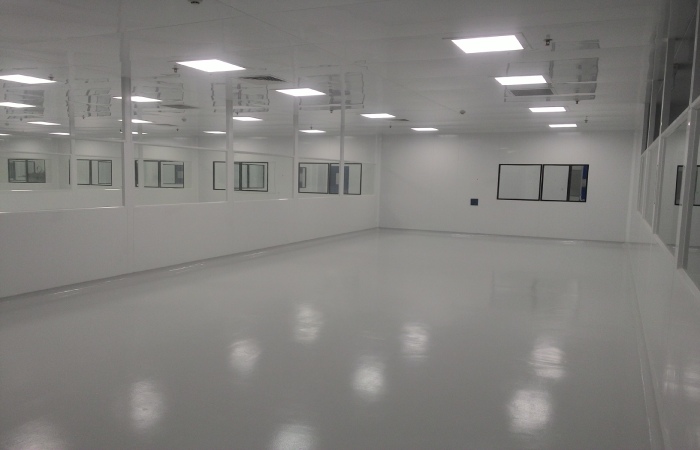 Cleanroom ceiling airflow outlets integrated with white wall panels and observation windows